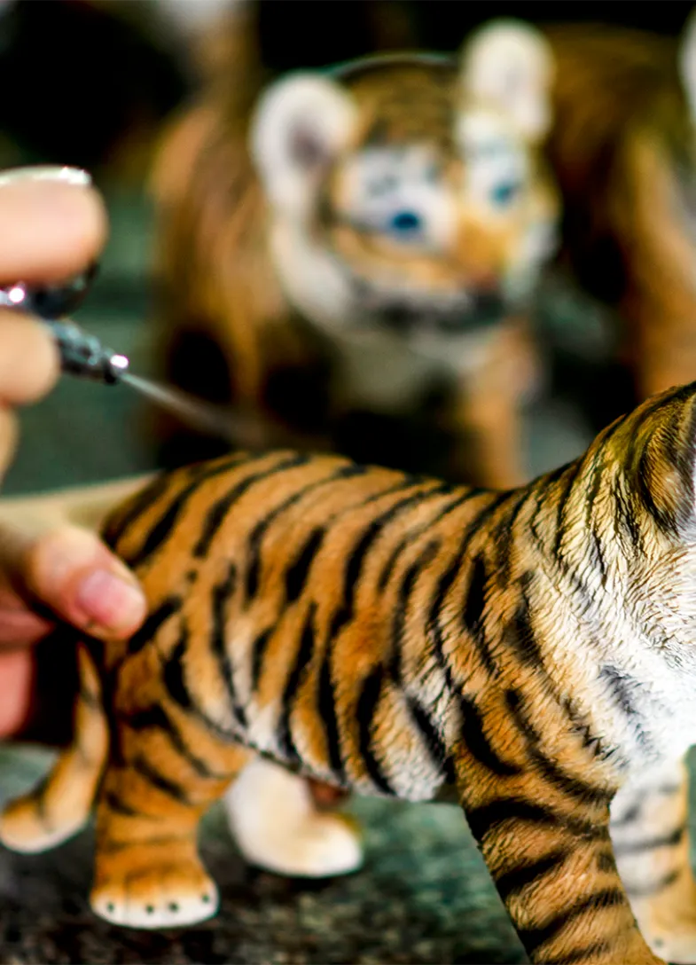 Paint added to a tiger figurine
